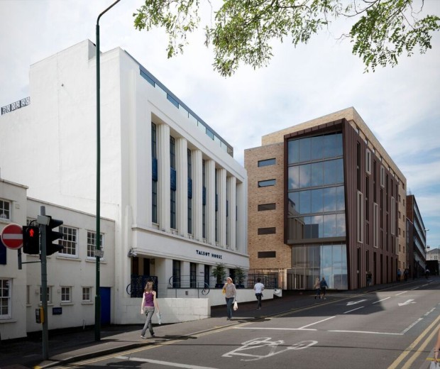  A visualisation of a new large brown building situated next to Talbot House